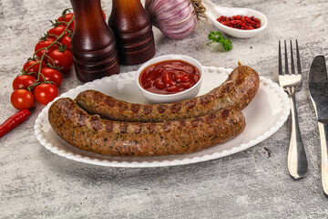 Grilled beef sausages with sauce