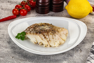 Baked cod fish fillet with spices
