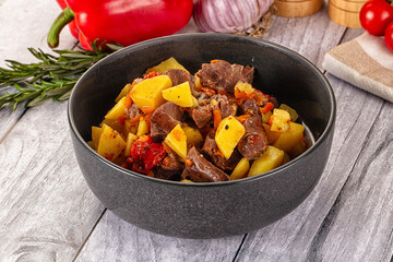 Rogiut with meat, potato and tomatoes
