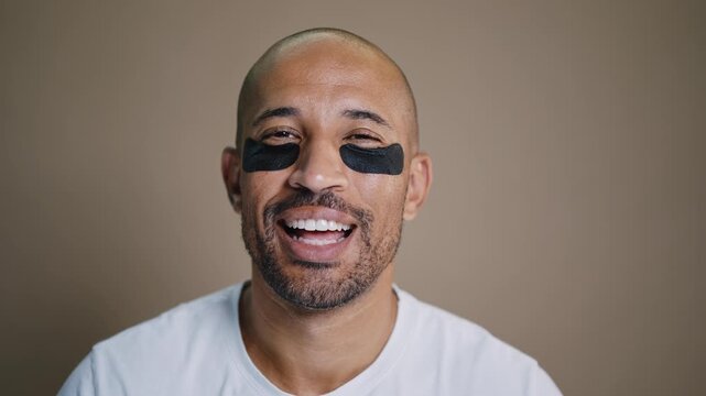 Beauty portrait of middle-aged hispanic black handsome man on colored background, concepts about beauty treatment, skincare and cosmetics for men	