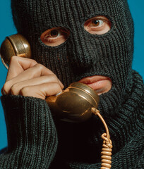 Thief with mask talking to the phone. Generative AI