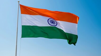 Indian flag waving majestically in the clear blue sky on a sunny day