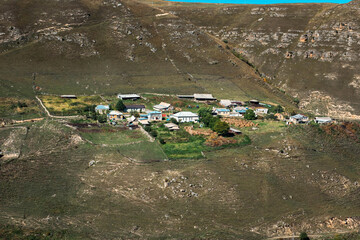 An aerial view of a small isolated village countryside in the lowland in the Caucasus, Russia