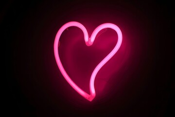 Pink Neon Heart Sign on Black Background - Love and Romance Symbol