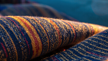 Fototapeta premium Close-up of a textured woven fabric with colorful stripes.