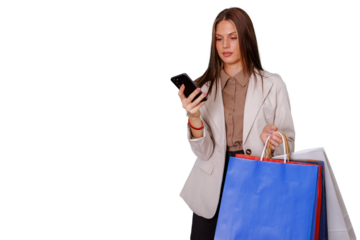 Young woman shopping, holding colorful bags and using smartphone for online purchases or checking list on transparent background