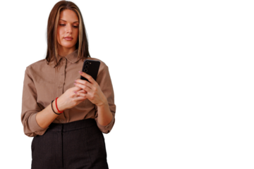 Young woman engrossed in smartphone, browsing social media or texting with serious expression, transparent background