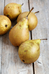 Pears on wooden table. Summer and autumn popular fruits.