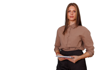 Professional businesswoman holding a tablet, standing confidently, planning and managing work with digital technology