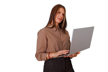 Businesswoman standing, focused on her work, typing on a modern laptop. She performs digital tasks against a transparent background