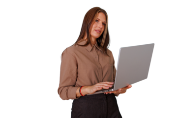 Businesswoman standing, focused on her work, typing on a modern laptop. She performs digital tasks against a transparent background