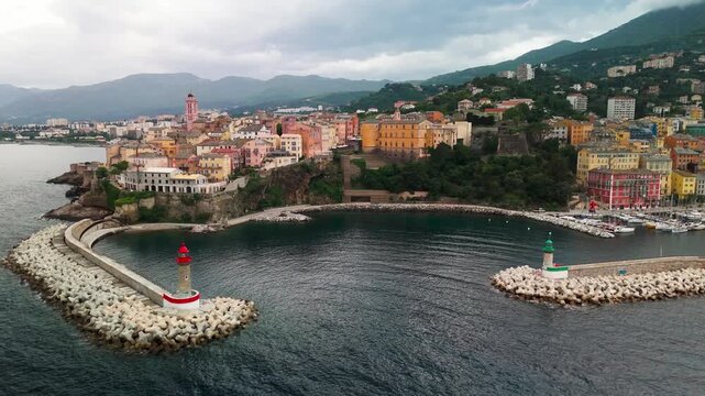 Smooth Aerial Drone Shot Entering the Historic Old Port and Approaching the Fortified Genoese Citadel in Bastia, Cap Corse, Corsica, France.