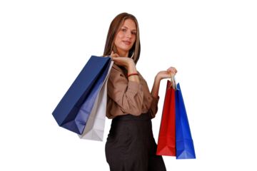 Woman enjoying successful shopping spree, holding multiple colorful bags and feeling happy on a transparent background