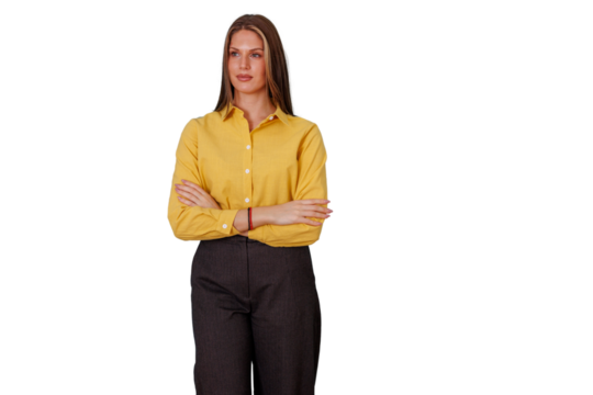 Confident businesswoman wearing a yellow shirt and dark pants with arms crossed, looking left on transparent background