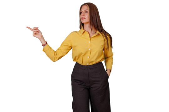 Young businesswoman pointing finger, indicating direction, providing information, making a choice, or showing presentation data