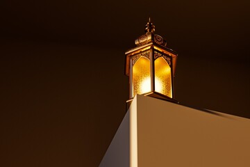 A beautifully designed Islamic lantern emits a warm glow, perched on a white surface against a dark backdrop, creating a cozy ambiance.