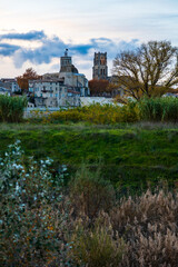 Fototapeta premium City of Pont-Saint-Esprit with its churches Saint-Saturnin and Saint-Pierre seen from the left bank of the Rhône at sunset