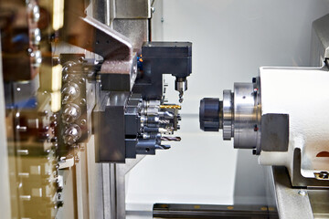 Sliding headstock metalwork machine