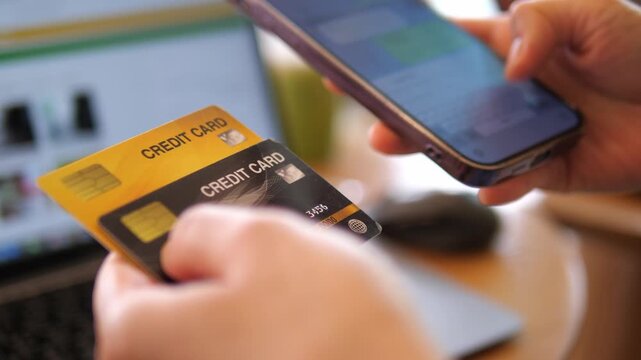 Hands Holding Credit Cards and Smartphone for Online Payment &ndash; Digital Banking, E-Commerce, Fintech 4K Footage