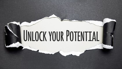 Inspirational "Unlock Your Potential" Message Revealed Through Textured Dark Torn Paper; Excellent for career coaching services, personal development blogs, and educational empowerment content.