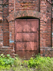 Brick wall and old iron door