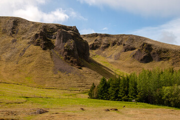Kirkjubaejarklaustur Iceland, view across meadow to mountains