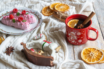 New Year is just around the corner, and on the table is hot tea with oranges and spices, as well as a children's toy horse - a symbol of 2026.