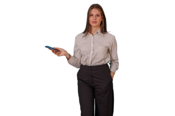 Businesswoman standing, holding a mobile phone in one hand and keeping another hand in pocket, communicating and staying connected