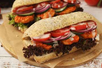 Baguette sandwiches with chicken and fresh vegetables	