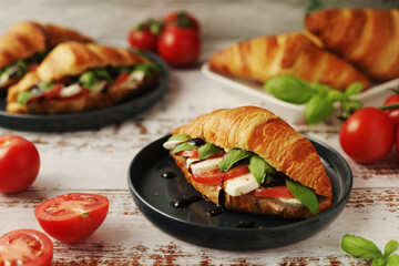 Croissants with mozarella cheese and tomatoes in caprese style