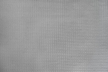abstract background of an old grey cotton voluminous fabric close up