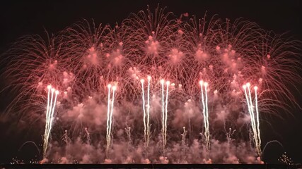 Spectacular fireworks display illuminates night sky with dazzling bursts and vibrant colors