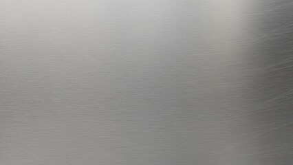 Sleek brushed metal texture for modern design projects, offering a sophisticated, industrial aesthetic for backgrounds and overlays in commercial applications