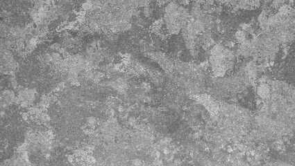 A close up of a gray stone surface with a rough and uneven texture creating a mottled appearance