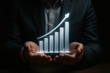 Business growth chart financial success upward trend glowing bar graph hands holding dark background professional attire investment increase data visualization positive progress