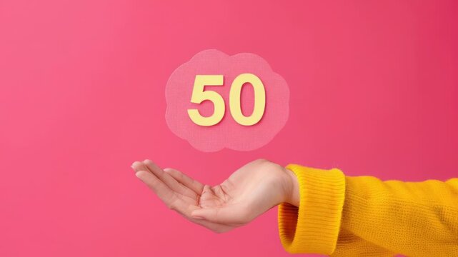 Video A person holding a sign with the number 50, great for various occasions and events