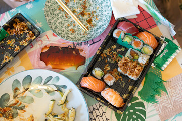 Enjoying sushi meal with chopsticks and soy sauce