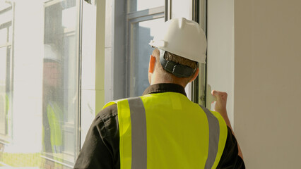 A construction foreman conducts an inspection at a construction site
