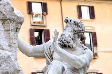 The figure of the Danube in Bernini's Fountain of the Four Rivers in Piazza Navona reflects the grandeur of the Baroque