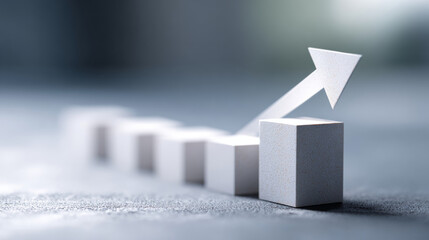 White ascending bar graph with arrow showing growth and progress on textured surface with blurred background