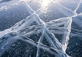 Close-Up Of Cracked Frozen Lake Surface With Trapped Air Bubbles And Sunlight Reflections, Showcasing Winter Nature Textures And Abstract Patterns.