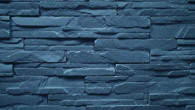 Dark blue stacked stone wall surface detailed texture background