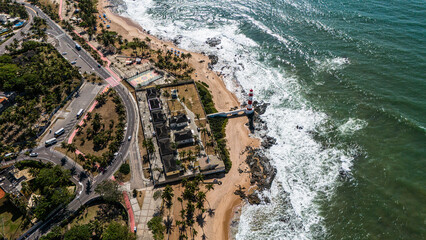 Itapuã Lighthouse and Salvador Shoreline: Wide Aerial View Showing Rocky Coast and Urban Area in Bahia, Brazil
