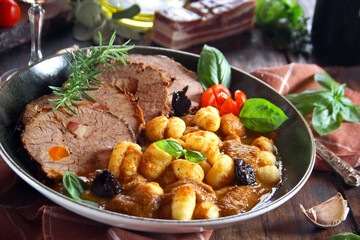 Pasticada with gnocchi, beef stew in a sauce. Croatian cuisine
