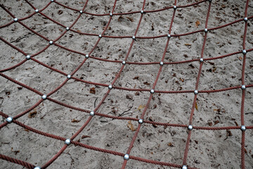 Close up of a net on a playground in a public park.