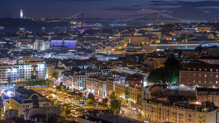 Lisbon after sunset aerial panorama view of city centre with red roofs at Autumn day to night timelapse, Portugal
