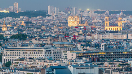 Aerial panorama above houses rooftops in a Paris day to night timelapse
