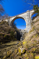 Pont du Diable bridge spanning narrow river gorge in FRANCE