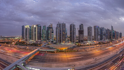 Obraz premium Aerial top view to Sheikh Zayed road near Dubai Marina and JLT day to night timelapse, Dubai.