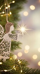 Obraz premium Wooden angel ornament hanging on a Christmas tree branch with glowing star and blurred lights in the background for holiday greeting card.